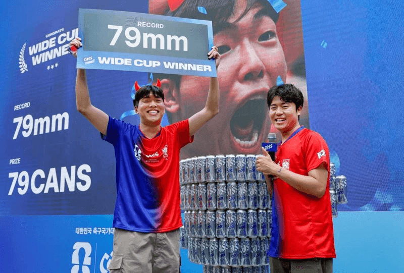 “입 크게 대한민국!” 제일기획, 카스와 월드컵 응원 열기 높이는 이색 이벤트 진행…평일 아침 응원전 살린 '입 크기 이벤트'